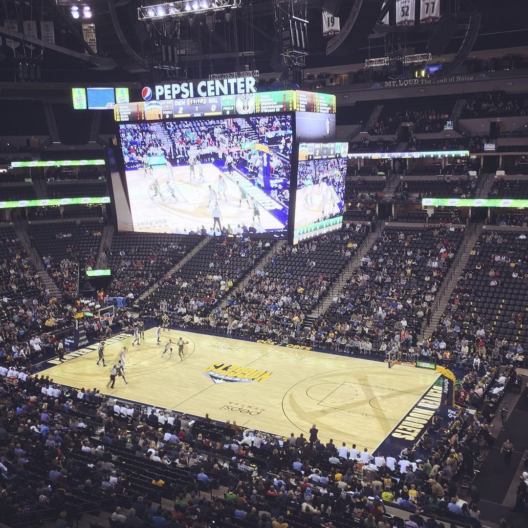 A crowd of roughly 9,500 people at a 2014 Nuggets game