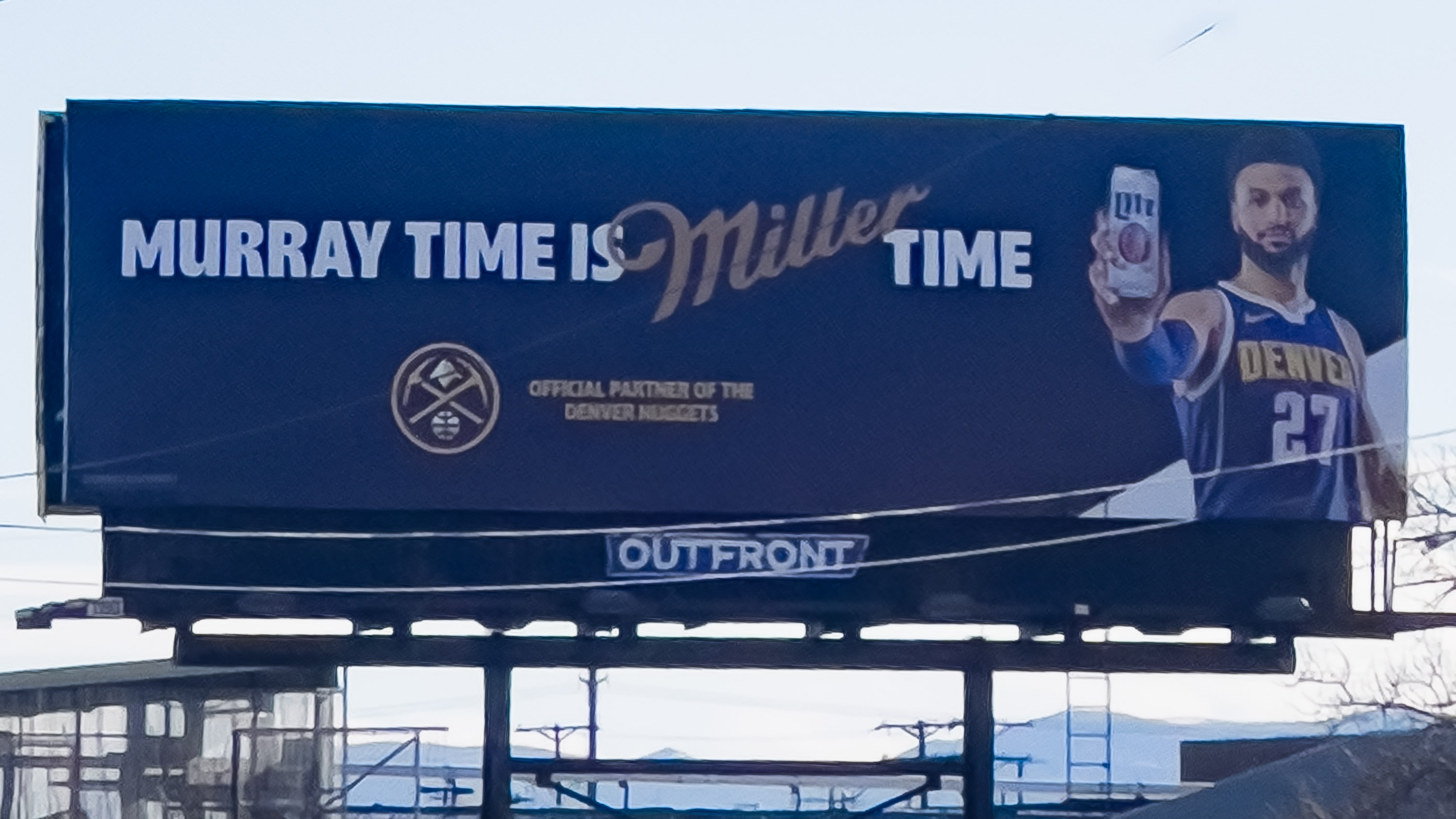 Jamal Murray on a billboard, getting his bag courtesy of Miller-Coors